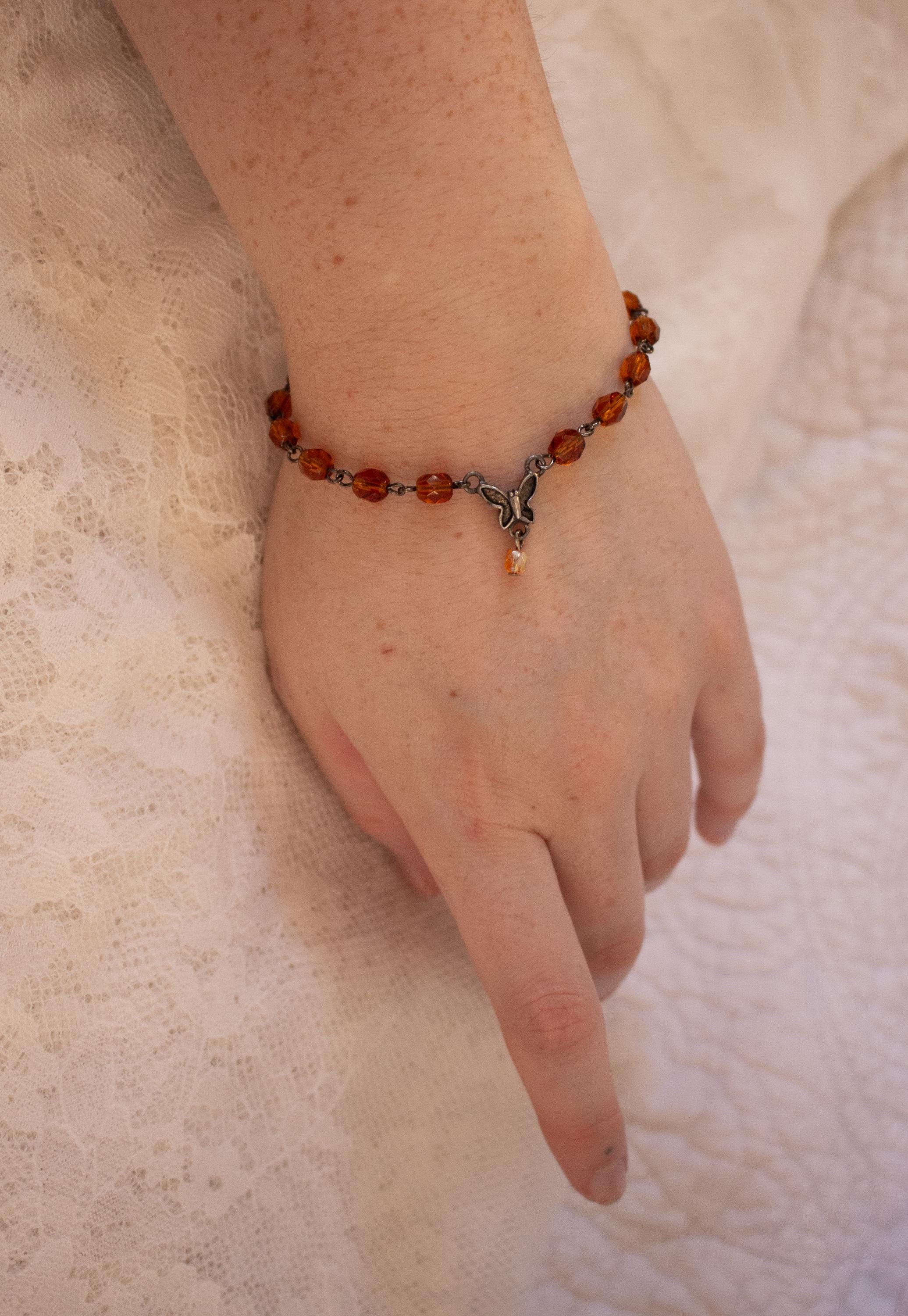 Vintage-Inspired Orange Glass Bead Bracelet with Butterfly Pendant