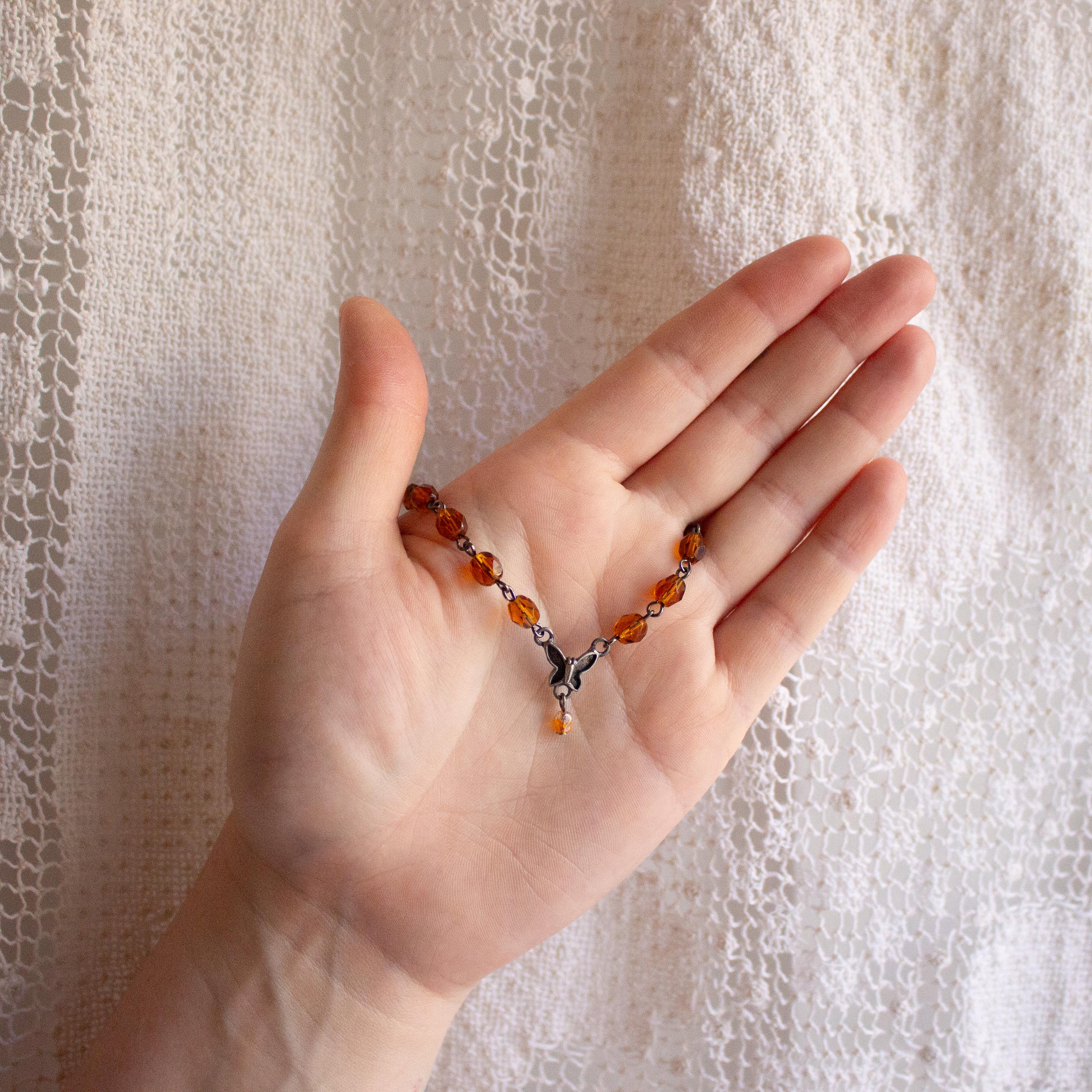 Vintage-Inspired Orange Glass Bead Bracelet with Butterfly Pendant