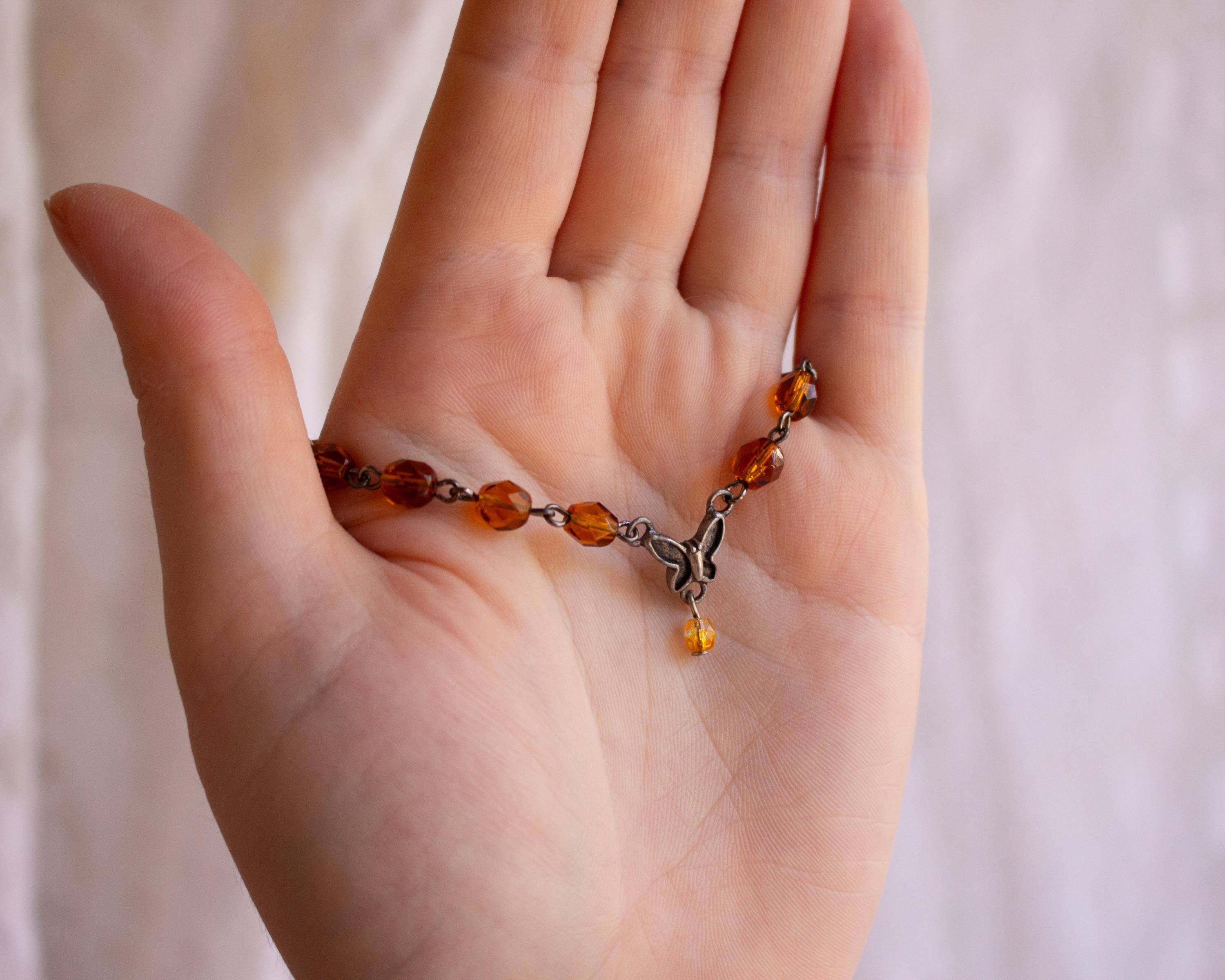Vintage-Inspired Orange Glass Bead Bracelet with Butterfly Pendant