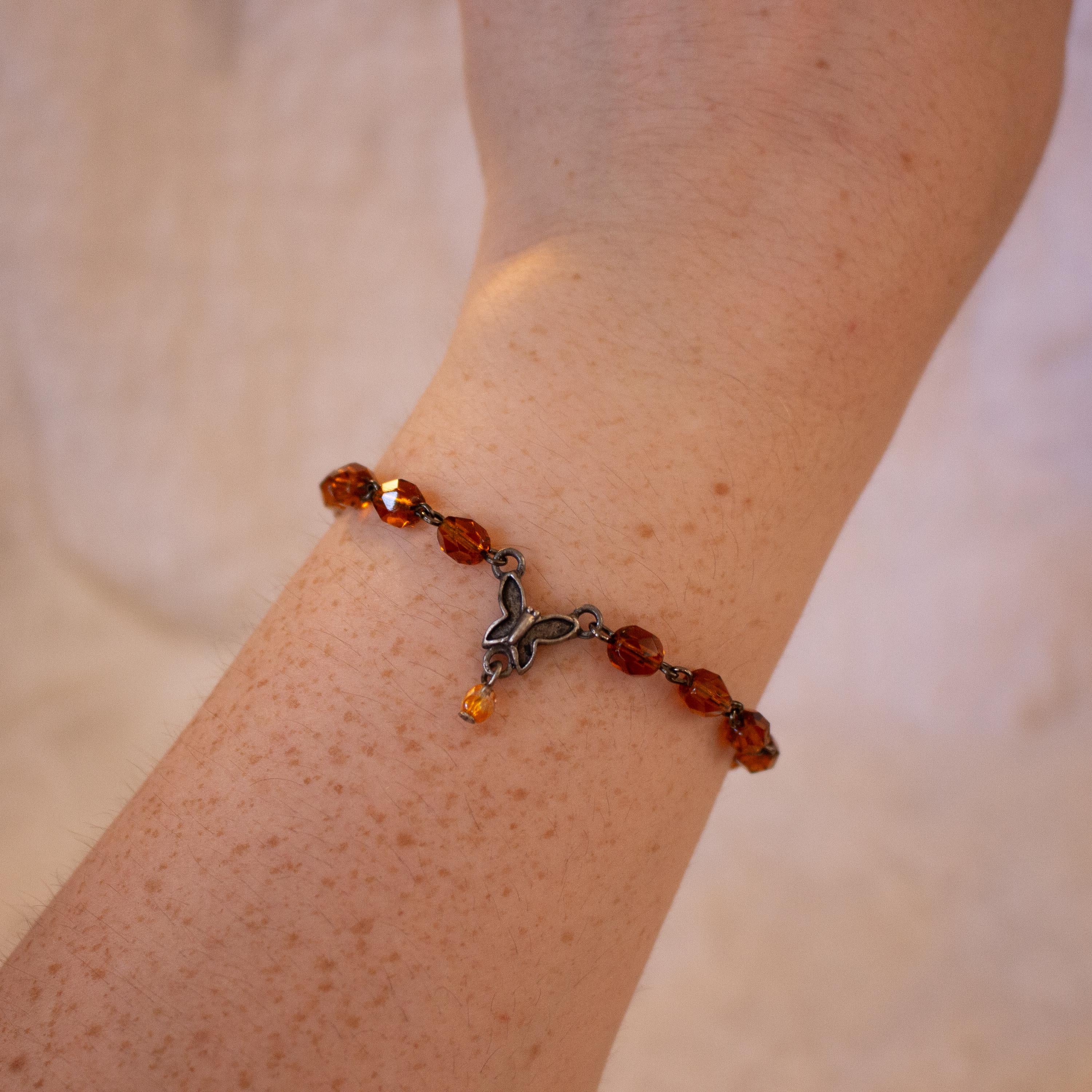 Vintage-Inspired Orange Glass Bead Bracelet with Butterfly Pendant