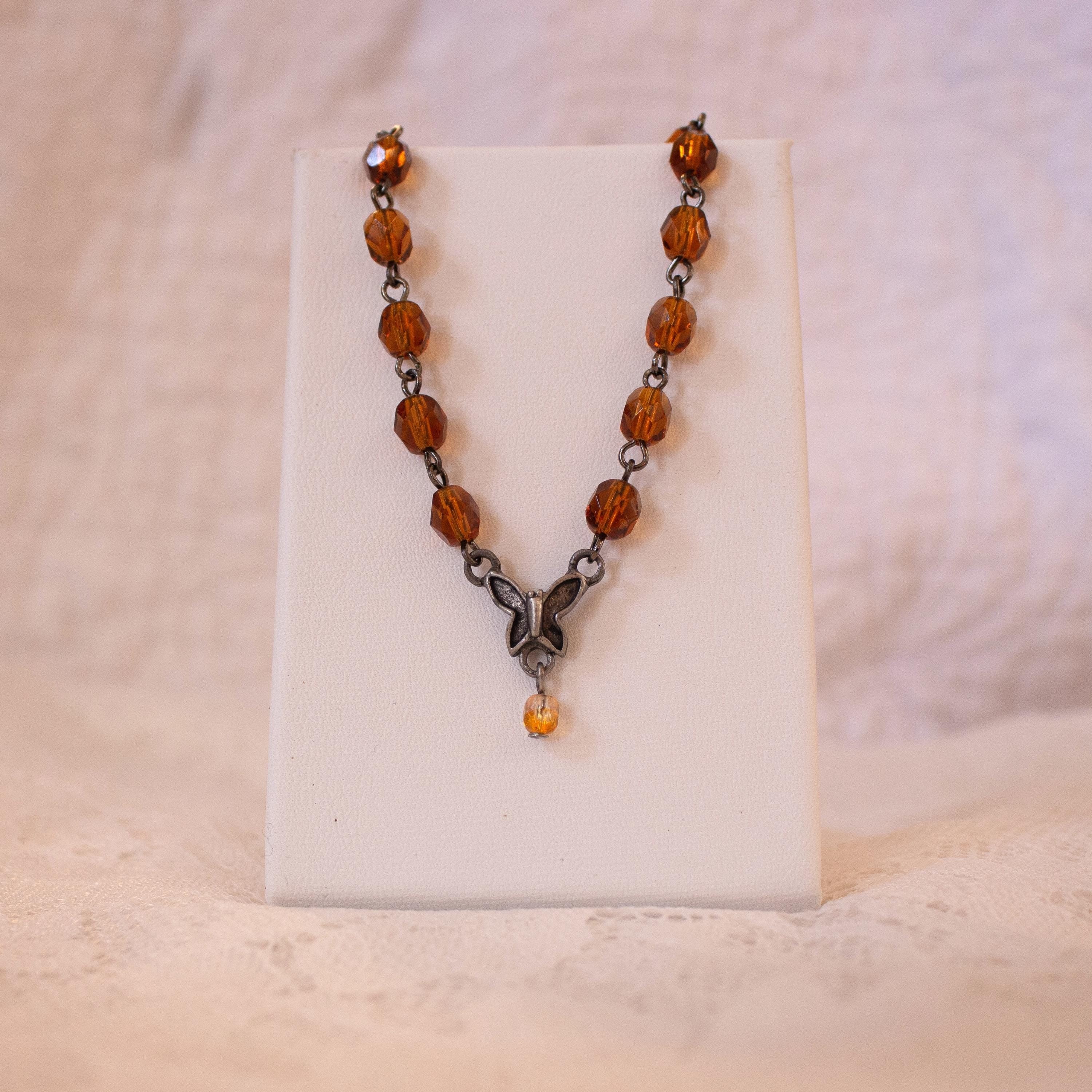 Vintage-Inspired Orange Glass Bead Bracelet with Butterfly Pendant