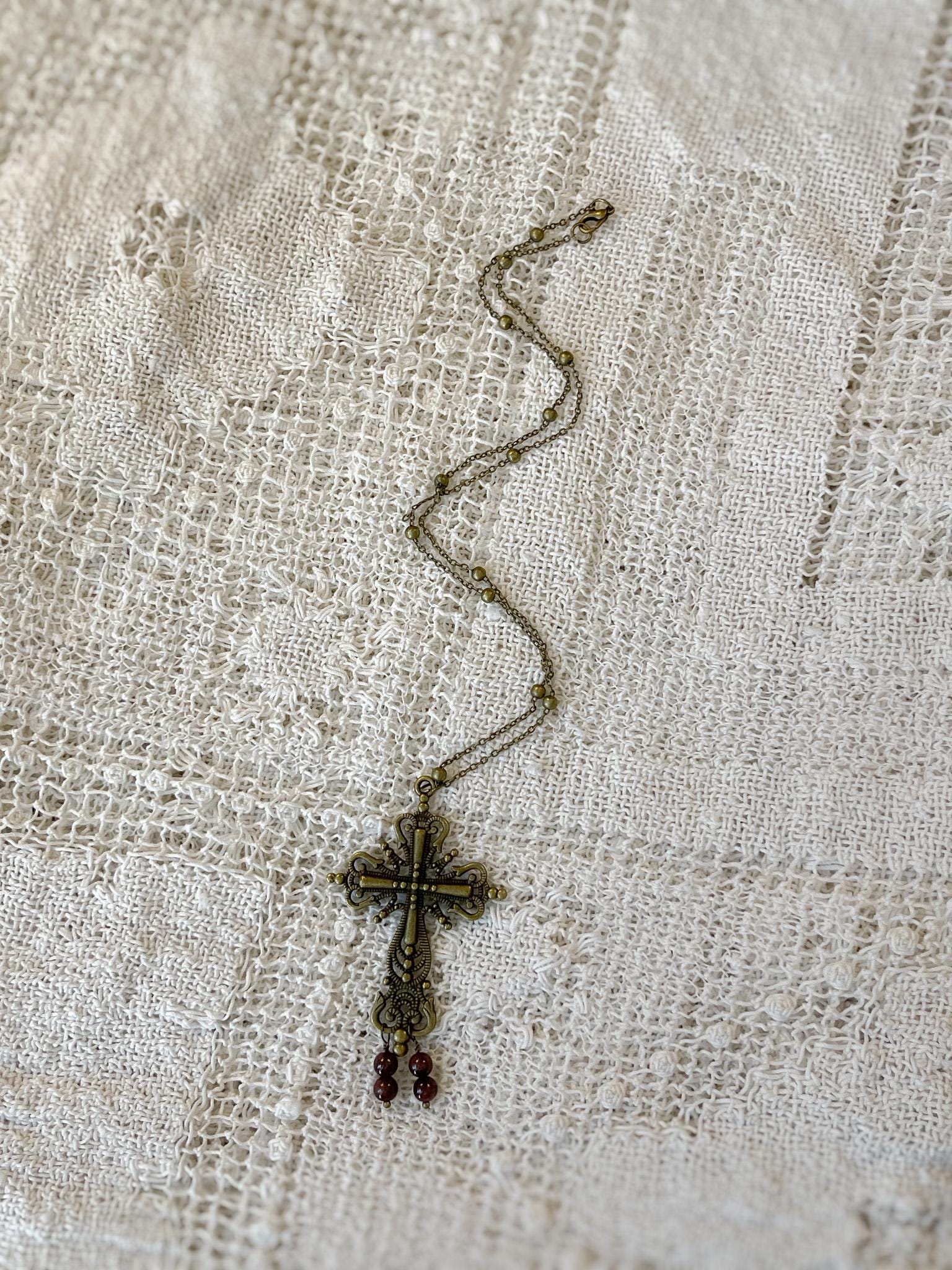 Vintage Inspired Bronze Cross Pendant Necklace With Garnet Bead Drops