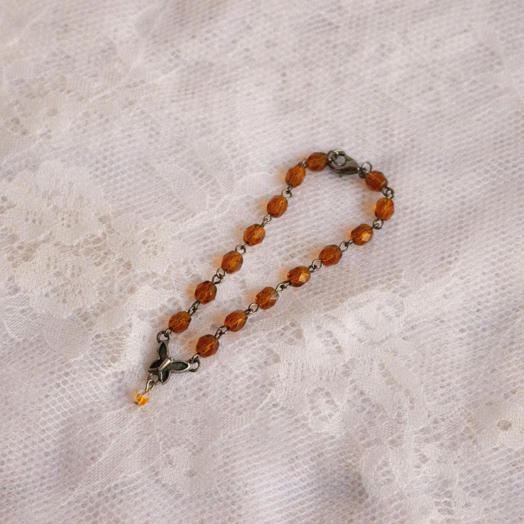 Vintage-Inspired Orange Glass Bead Bracelet with Butterfly Pendant