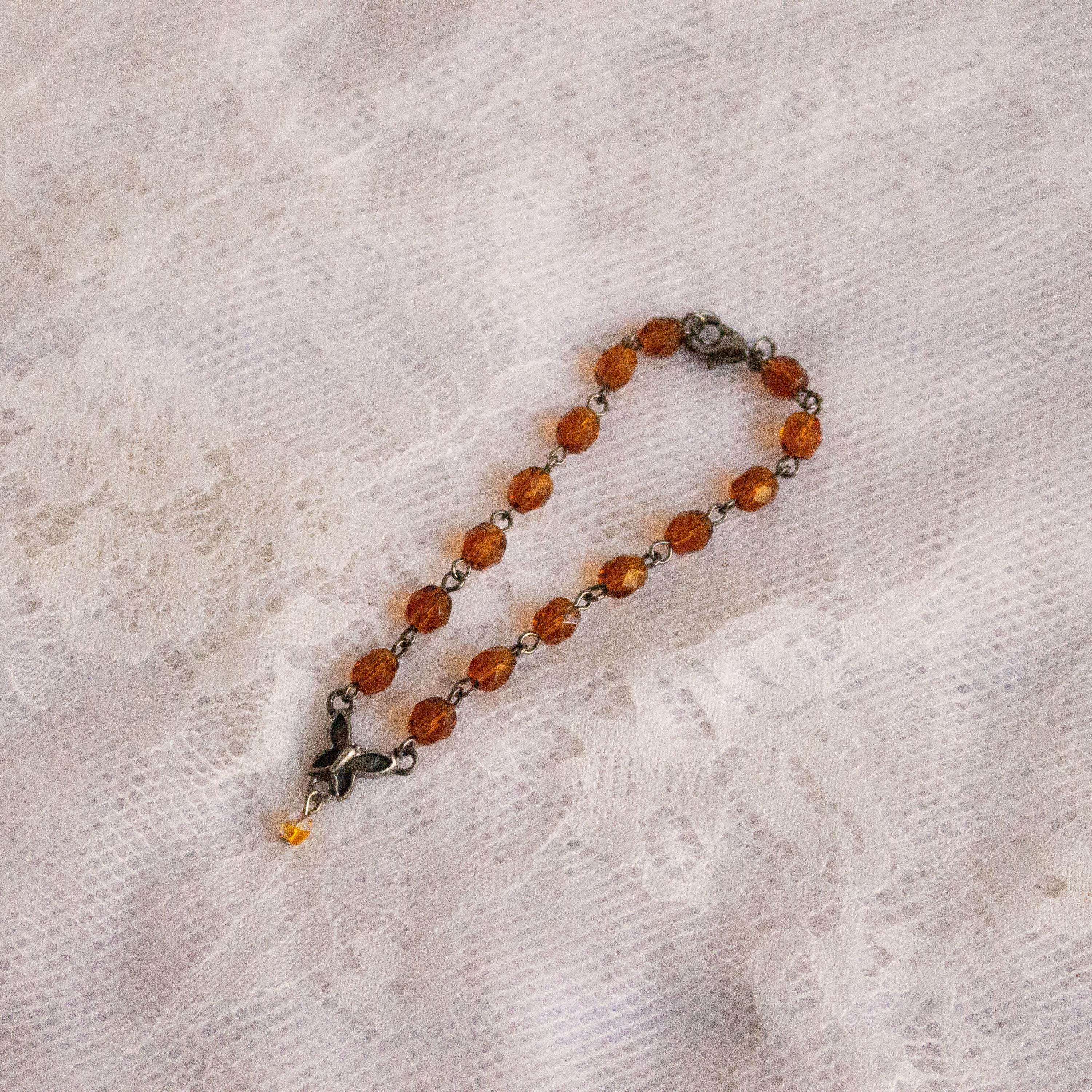 Vintage-Inspired Orange Glass Bead Bracelet with Butterfly Pendant