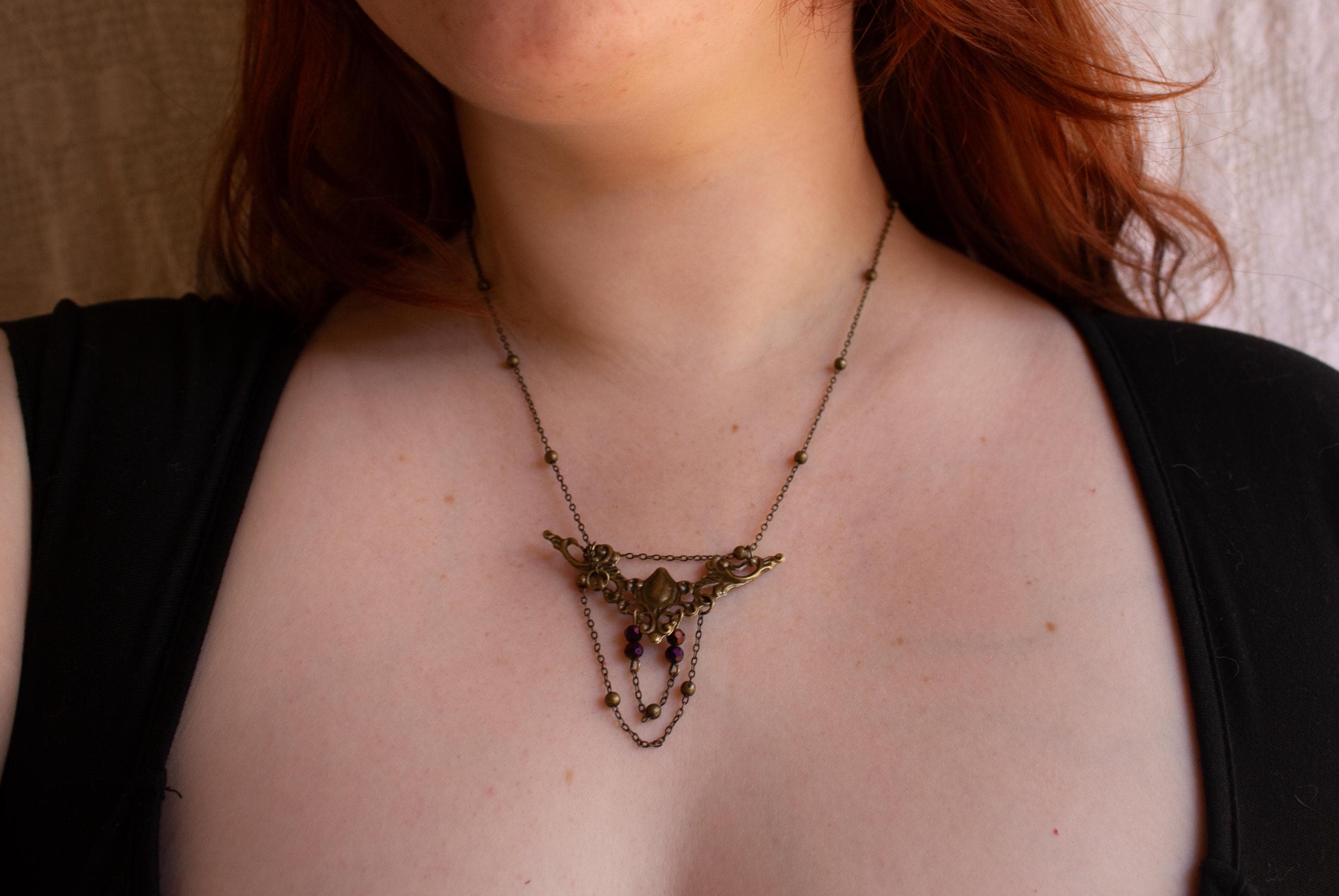 Vintage Art Nouveau Inspired Bronze Filigree Necklace with Two Chain Loops and Dark Purple Reflective Beads