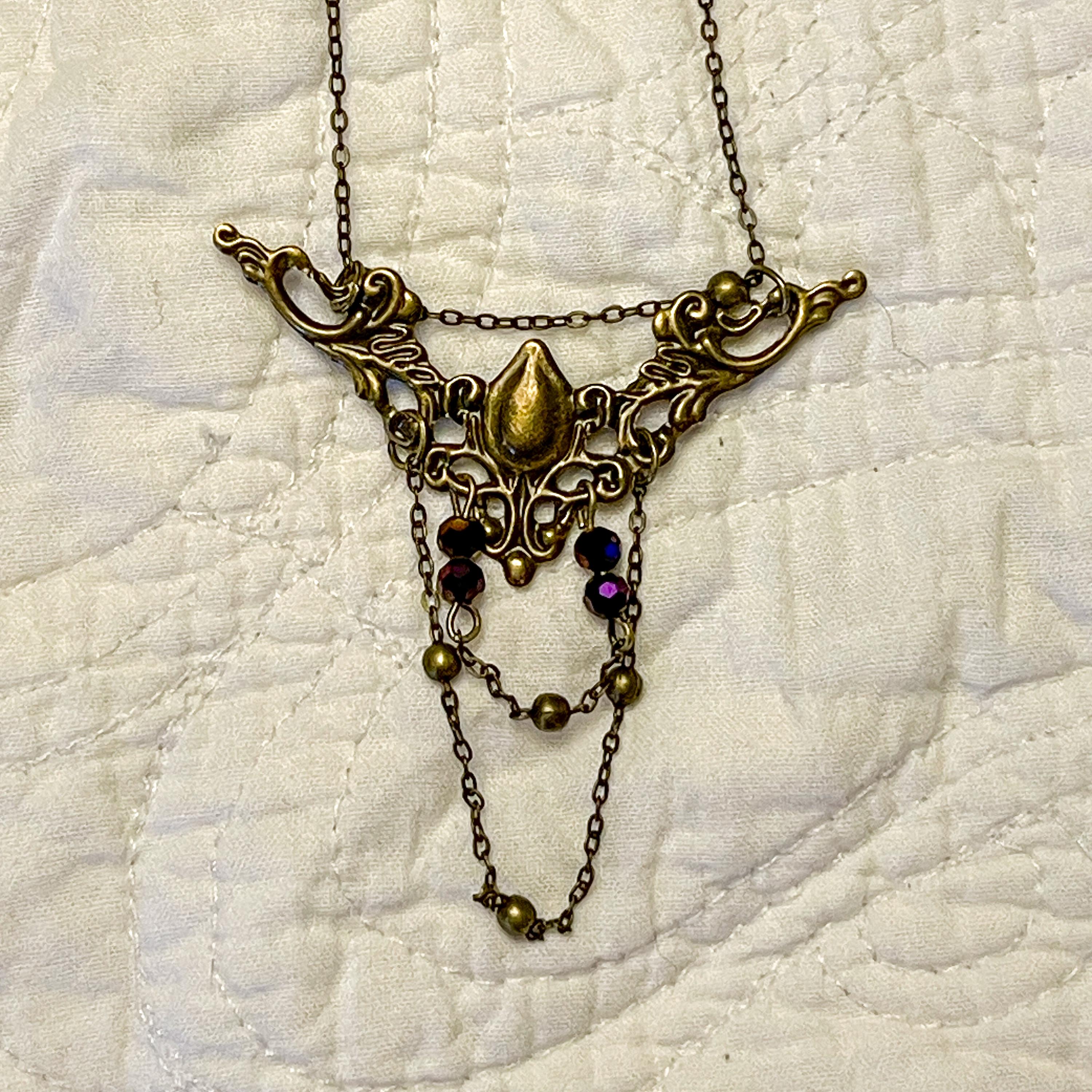 Vintage Art Nouveau Inspired Bronze Filigree Necklace with Two Chain Loops and Dark Purple Reflective Beads