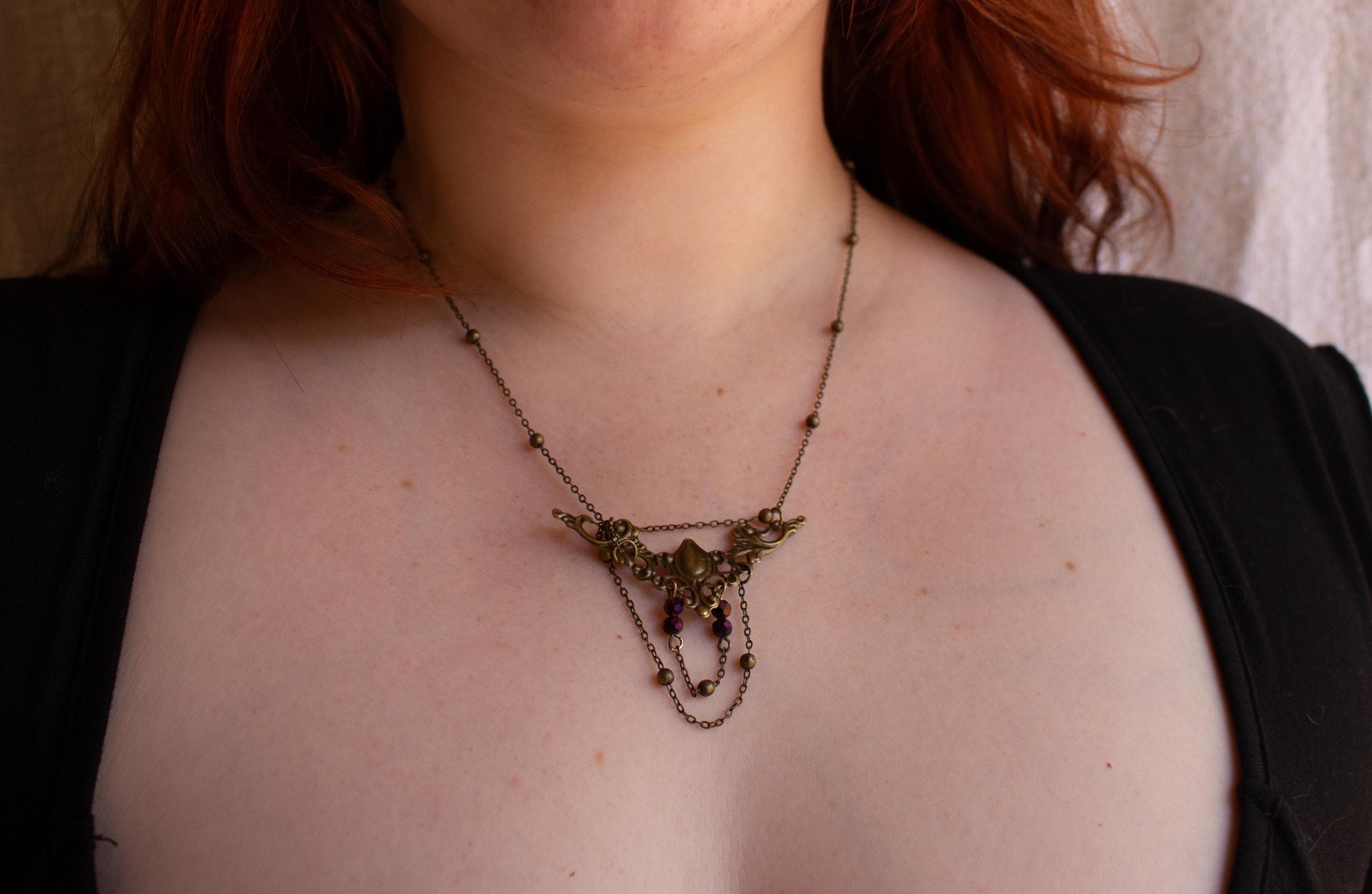 Vintage Art Nouveau Inspired Bronze Filigree Necklace with Two Chain Loops and Dark Purple Reflective Beads
