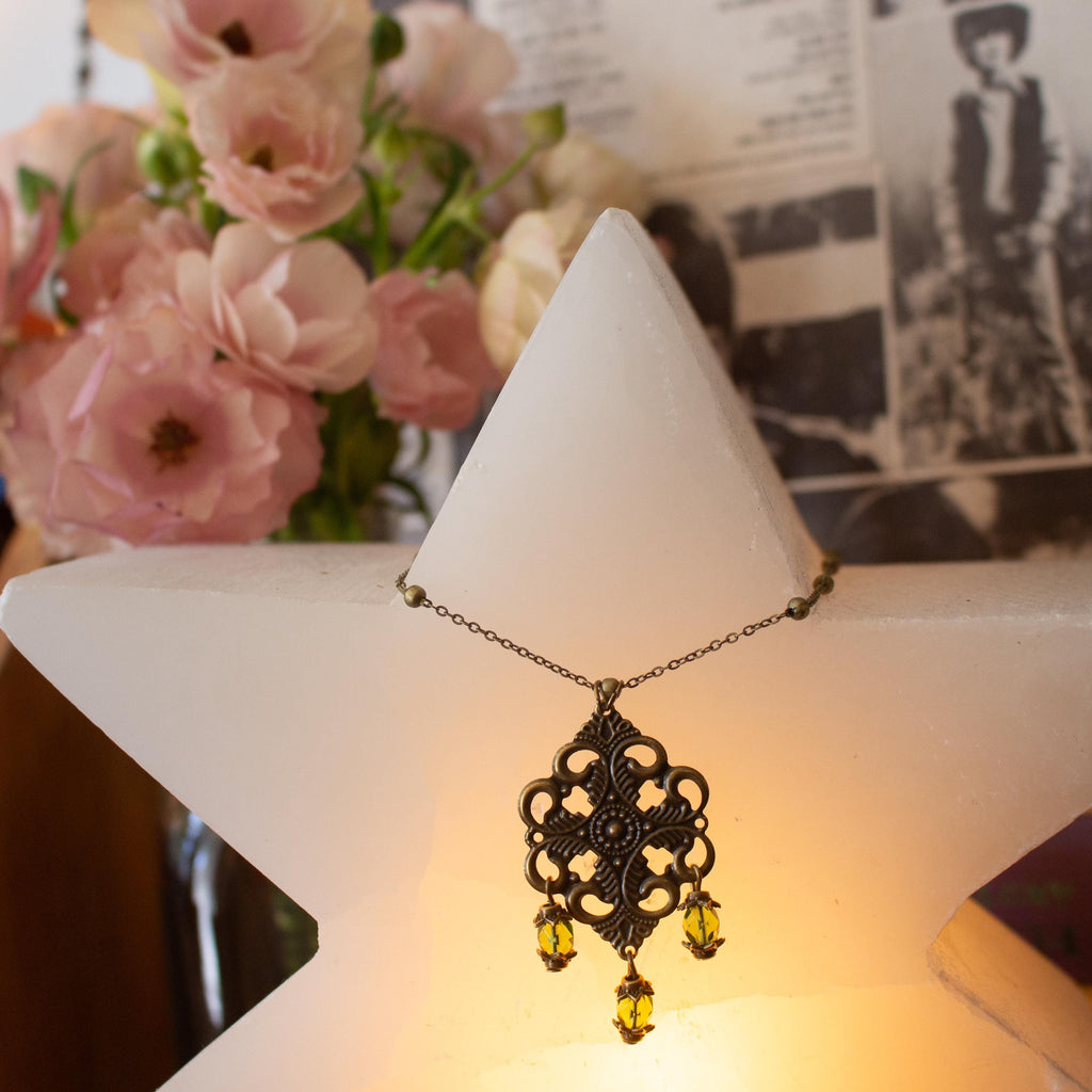 Vintage-Inspired Bronze Filigree Pendant With Green Glass Beads