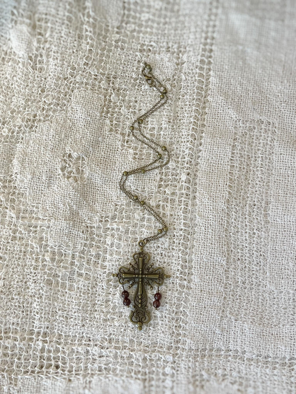 Vintage Inspired Bronze Cross Pendant Necklace With Garnet Bead Drops