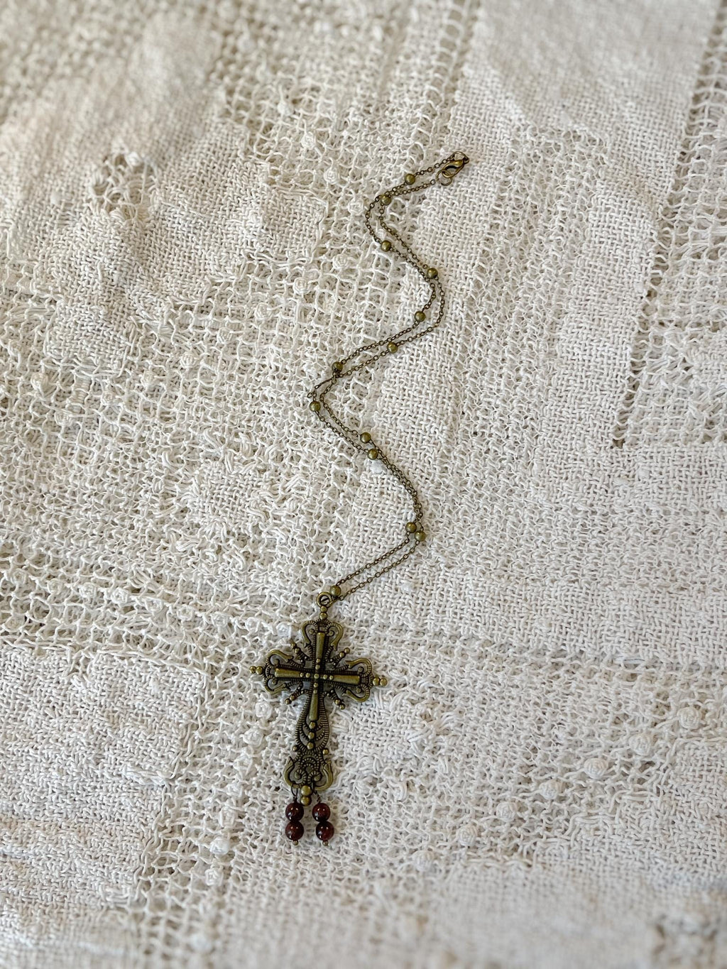 Vintage Inspired Bronze Cross Pendant Necklace With Garnet Bead Drops