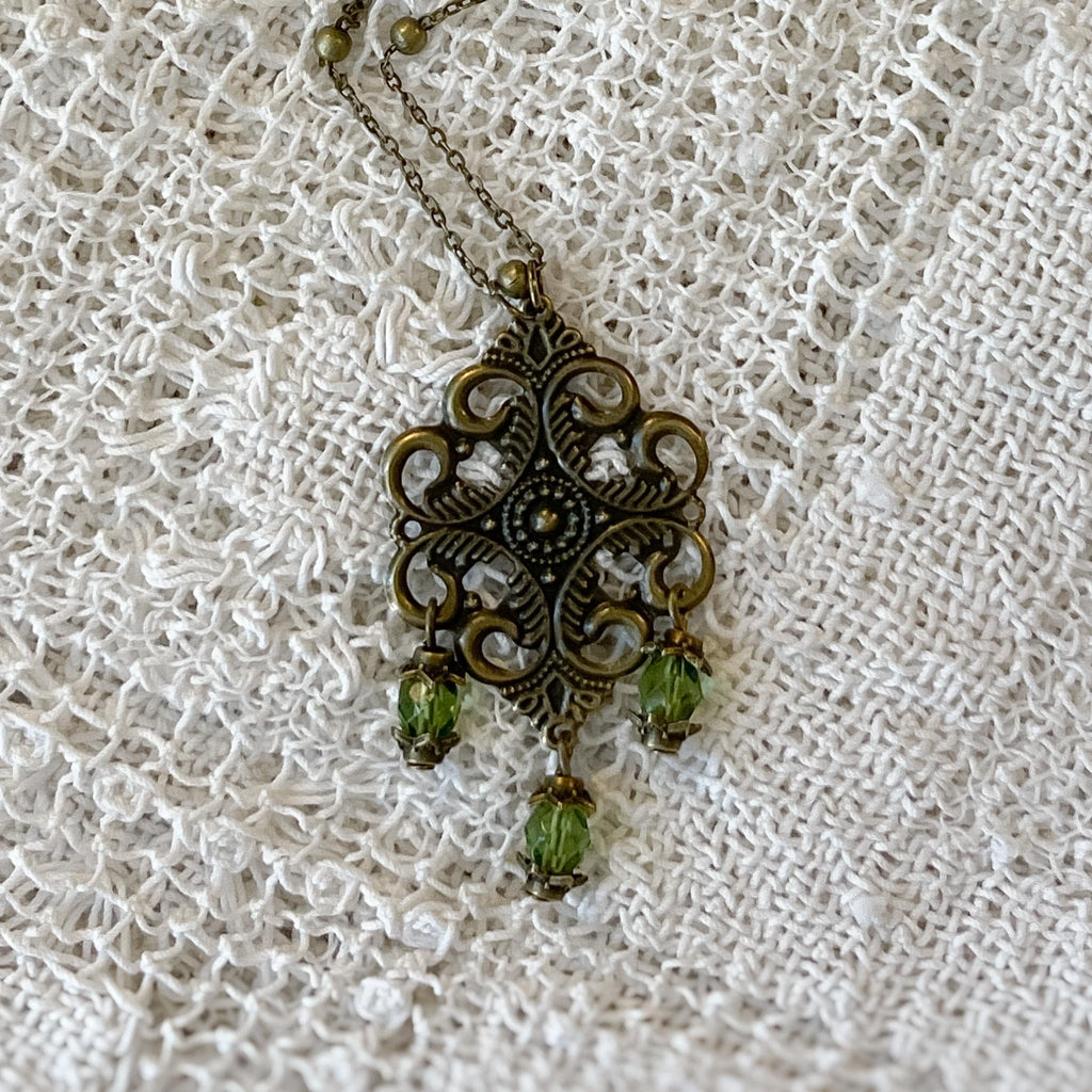 Vintage-Inspired Bronze Filigree Pendant With Green Glass Beads